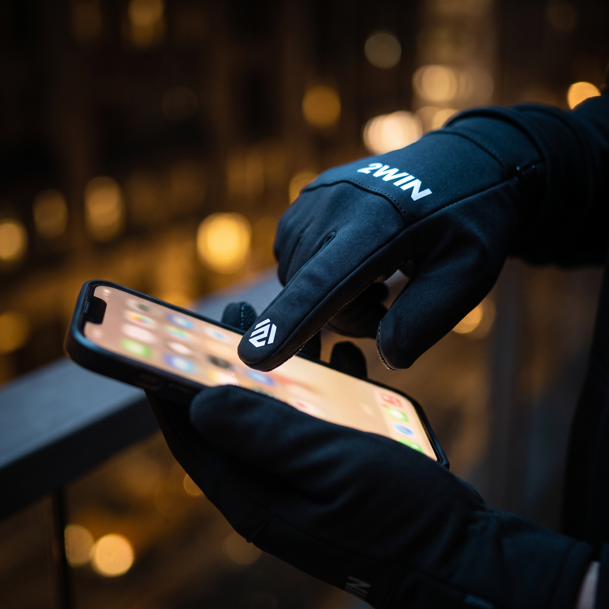2WIN gloves texting on phone — touchscreen fingertips at night